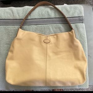 Tod's is a large leather tote known for its premium Italian craftsmanship.